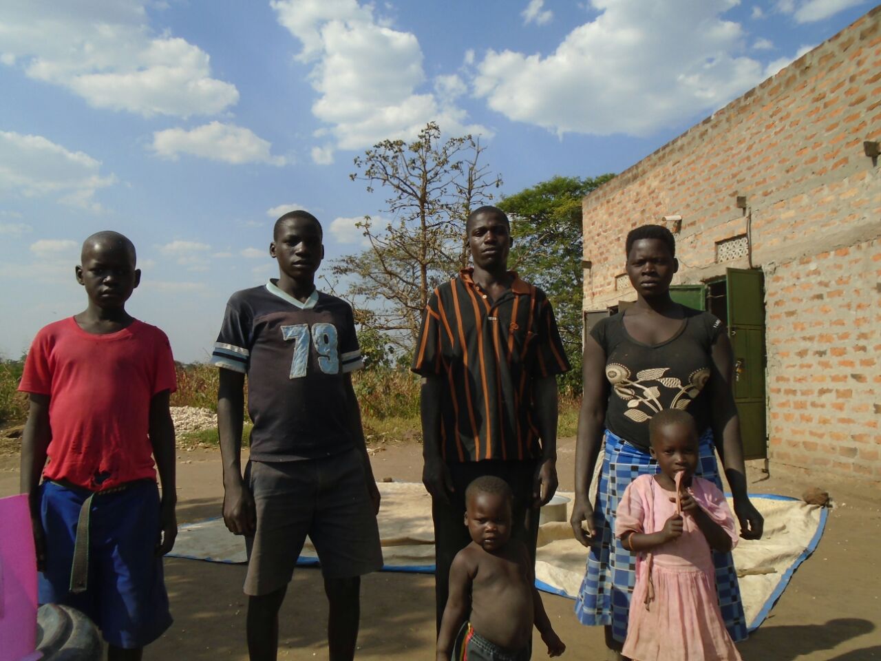 Brenda Okello right with her family